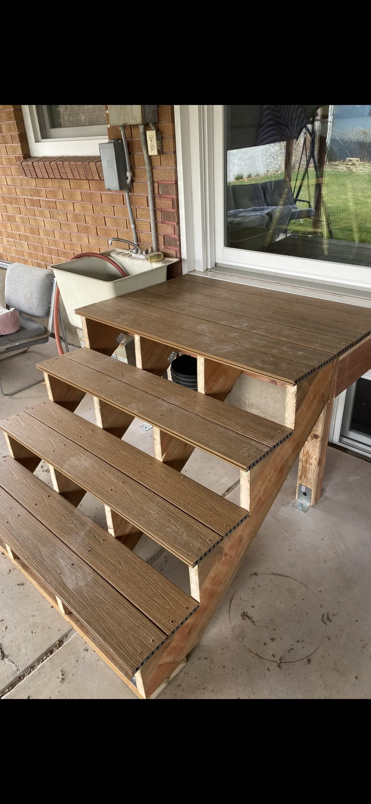 Wooden deck stairs with built-in storage compartments under each step