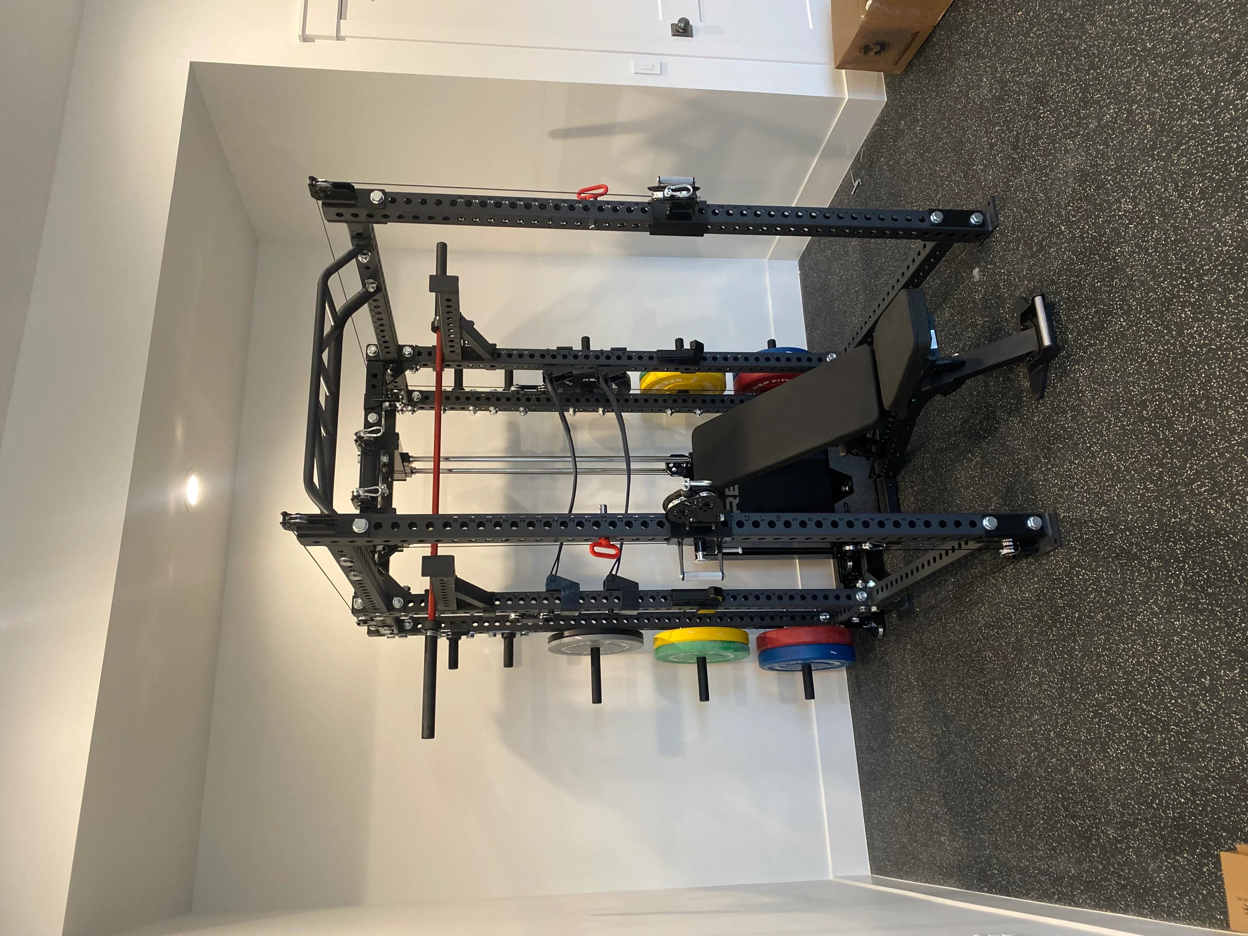 Black perforated steel wall-mounted tool rack with adjustable rails and organized hand tool storage